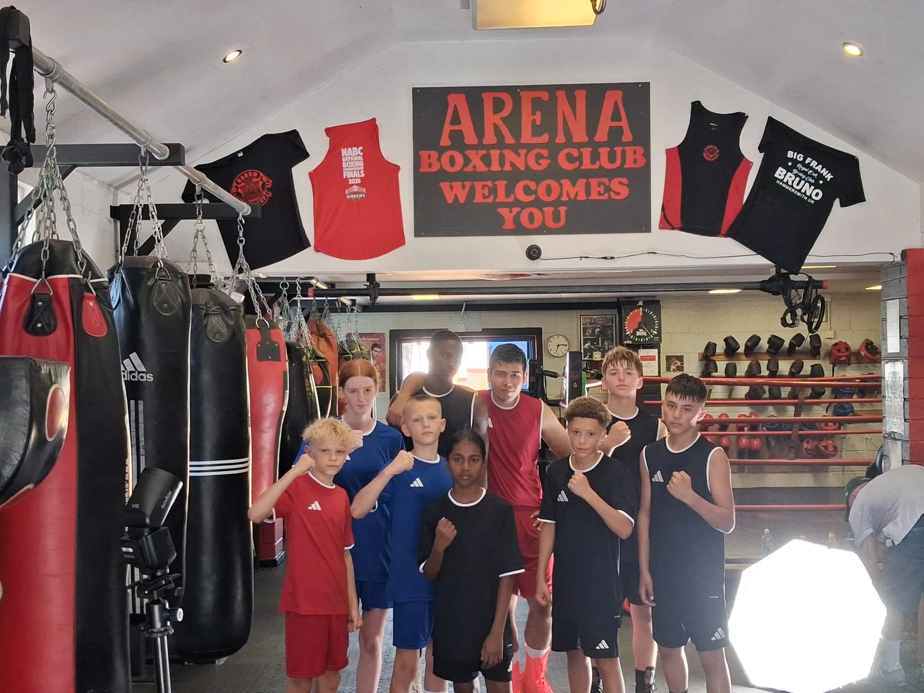 Arena junior boxers together beside the ring at the Bournemouth gym