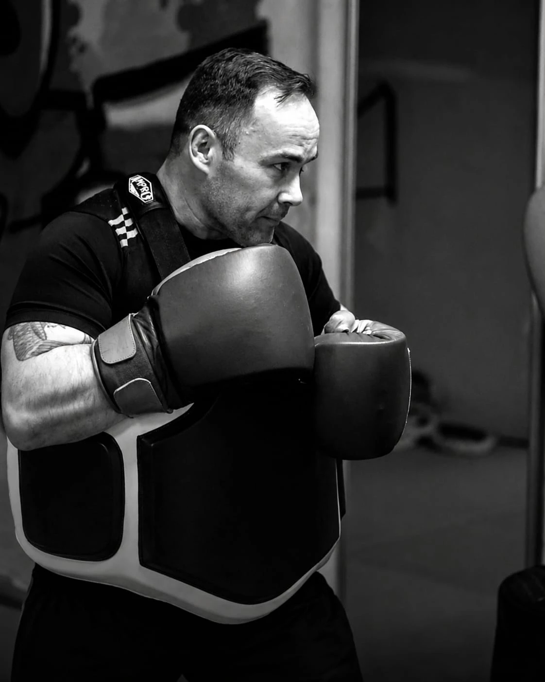 Arena Boxing Club Coach and Chairman Les Simmons leading a pad-work session