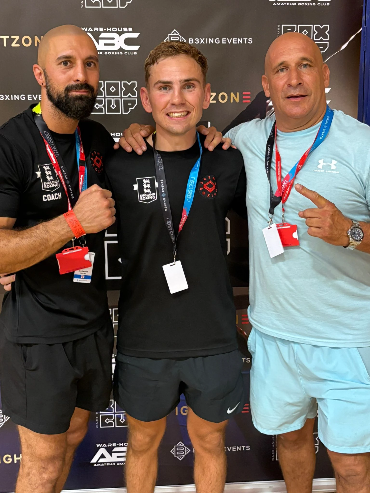 Arena boxer celebrating Box Cup success with coaches Amir Saghalati and Geoff Page