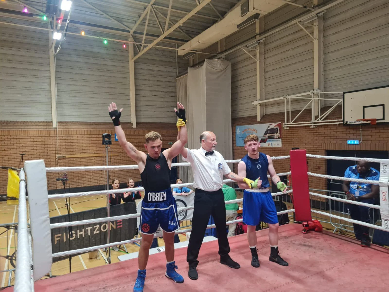 Arena boxer celebrating a victory in the ring